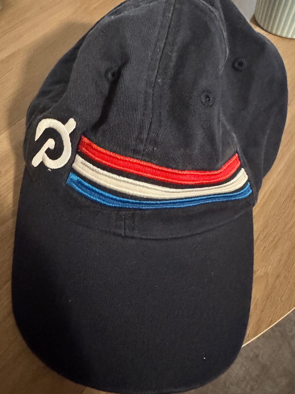 Peloton Navy Cap with Red, White, and Blue Stripe